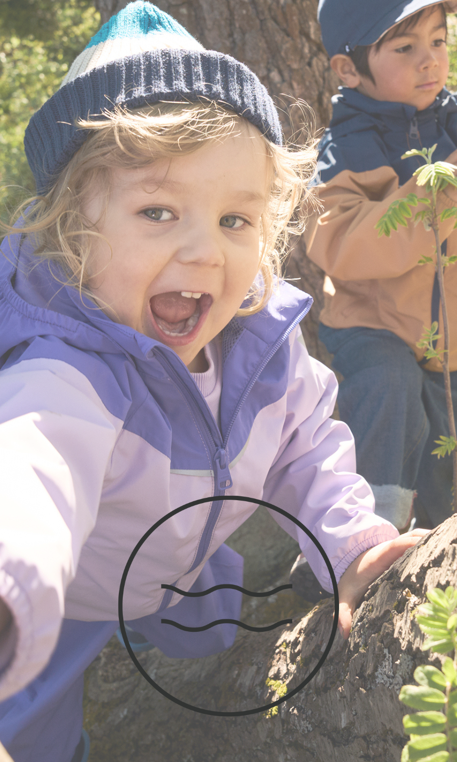 Two children running outdoors in waterproof jackets and winter hats – durable, weatherproof kids outdoor clothing for all seasons