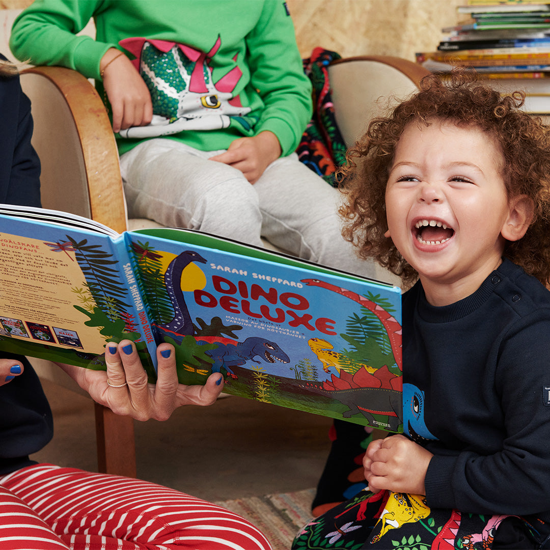 Book The Open-Air Life by Linda Åkeson McGurk held outdoors in a natural setting