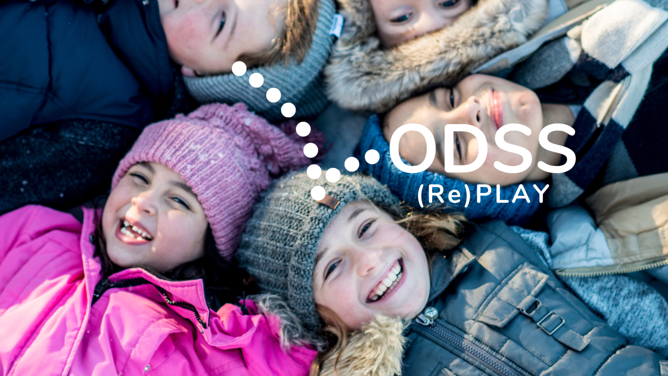 Children wearing winter clothing with ODSS (Re)PLAY logo overlay