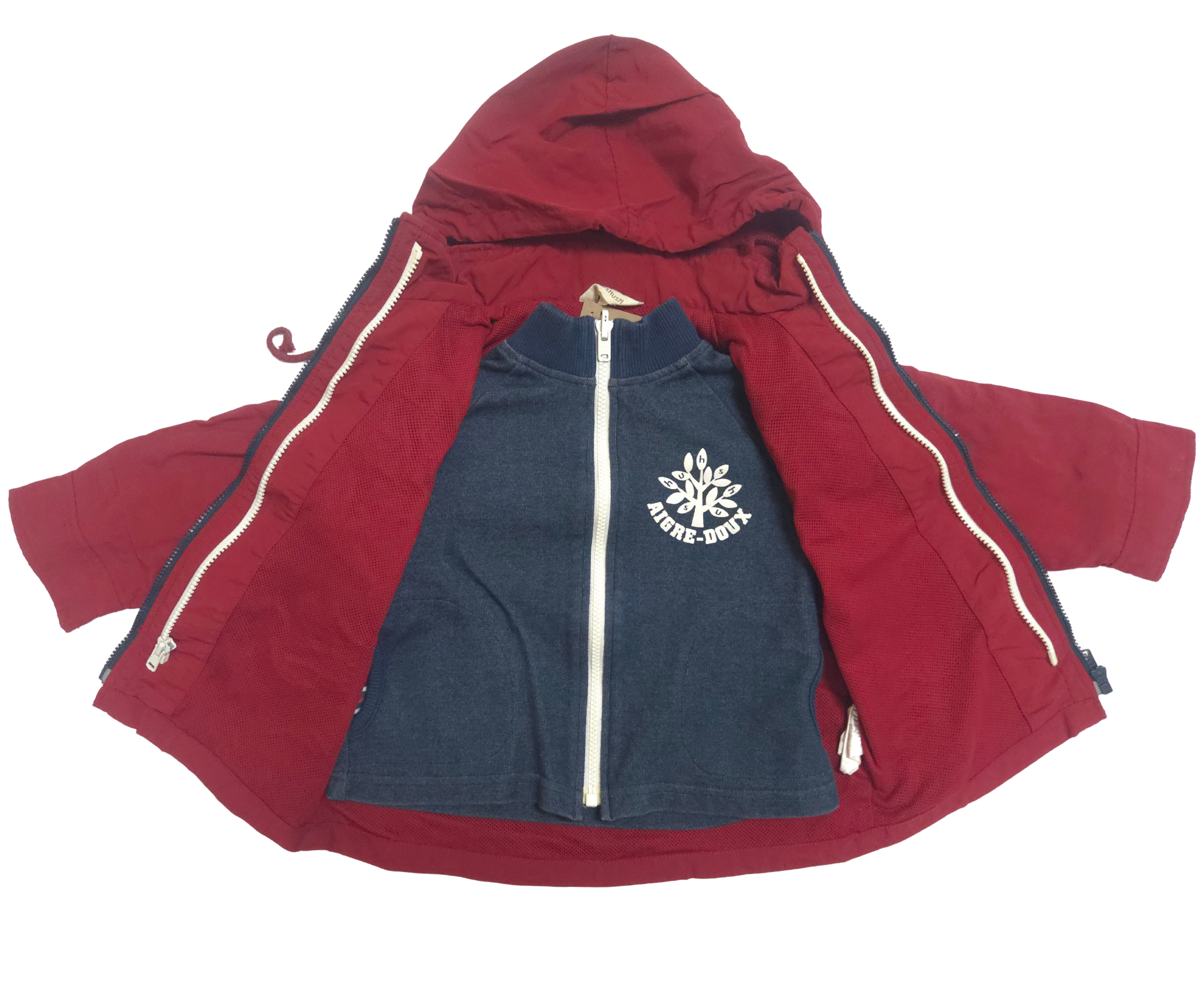 Red jacket with a navy blue inner lining featuring a white logo on