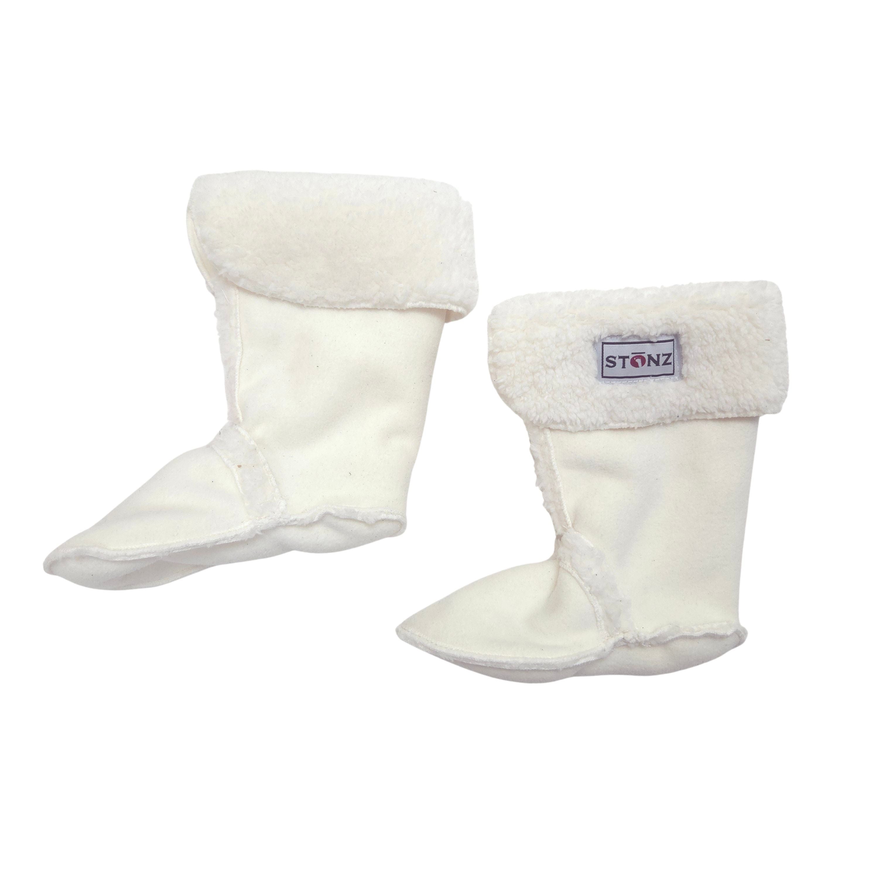 A pair of white boot liner with soft white faux-fur trim at the top, shown on a plain white background. One boot has a visible brand label that reads 'STONZ'.