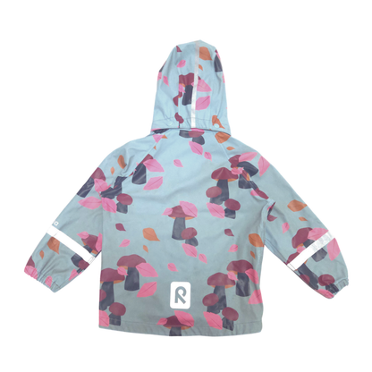 Children's raincoat with colorful leaf pattern on a light blue background