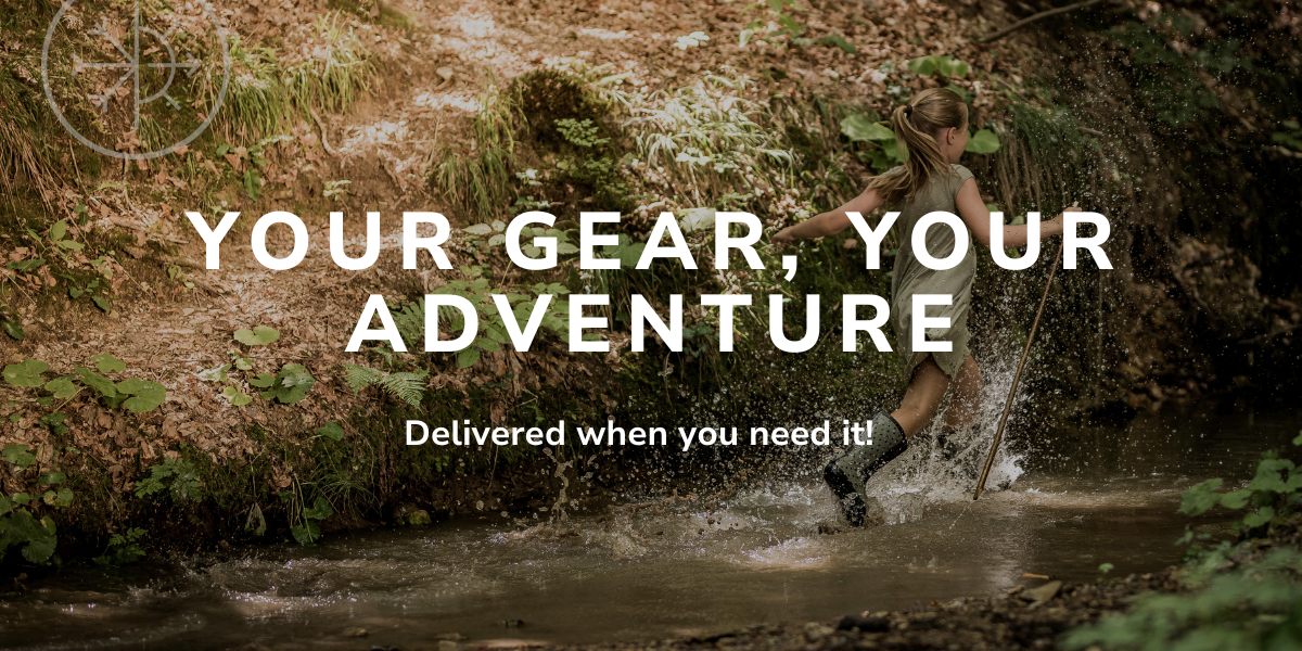 Person wading through a stream with text 'Your Gear, Your Adventure' in a forest setting.